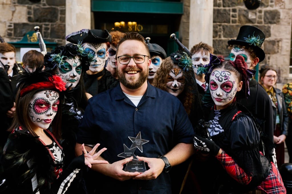 Me with performers from Rubber Chicken Theatre and my Debut Prize trophy