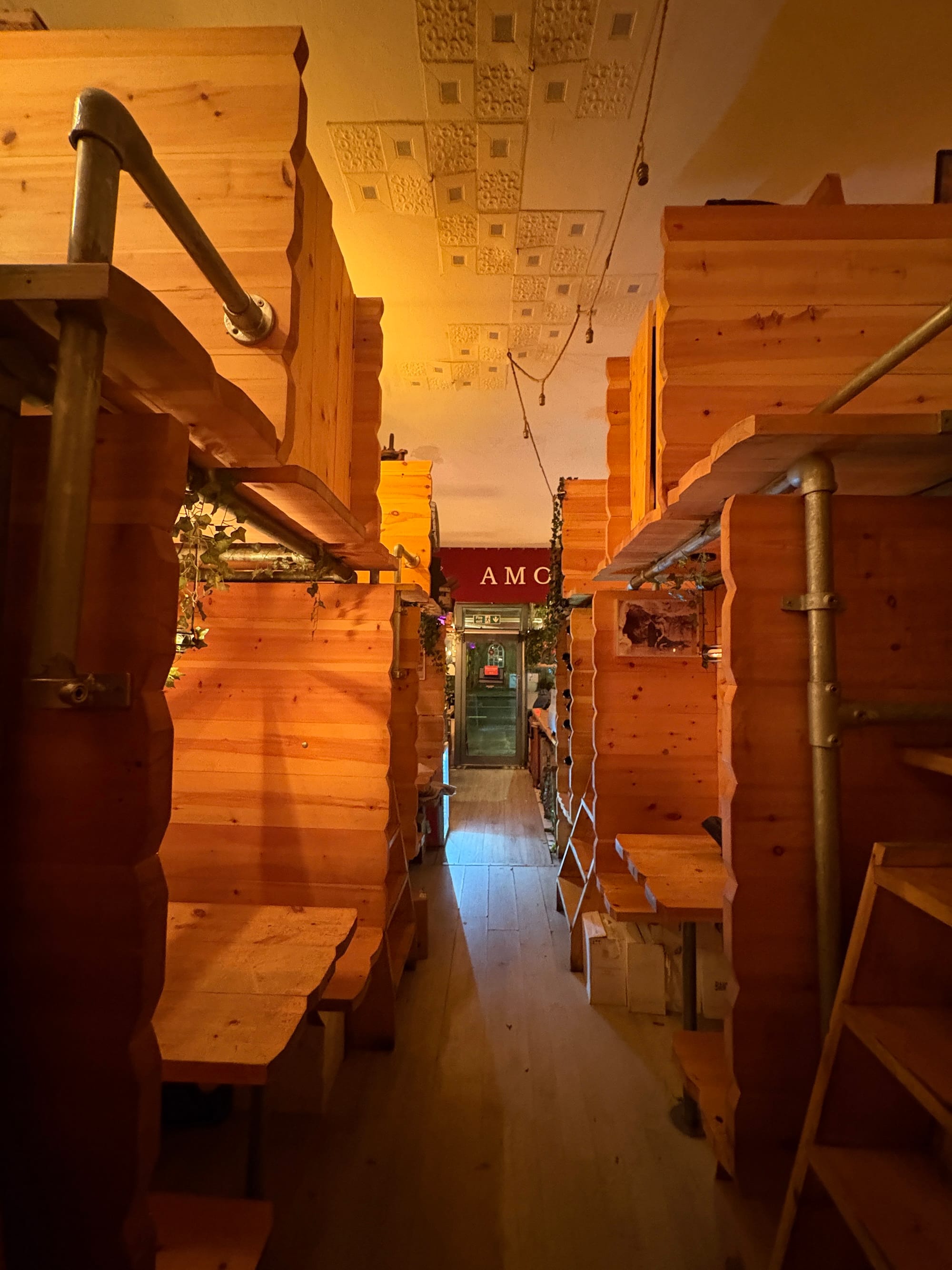 Wooden booths and ladders inside Amor, Holloway Road, London